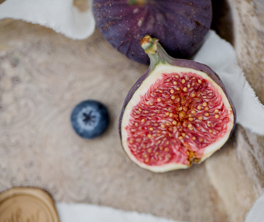 Photo of fig and blueberry on light background