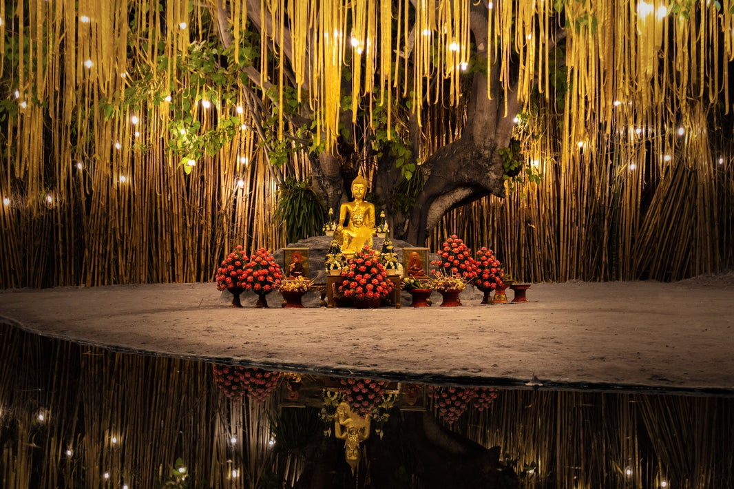 Traditional Chinese lanterns hanging in temple with warm golden lighting and red architectural details