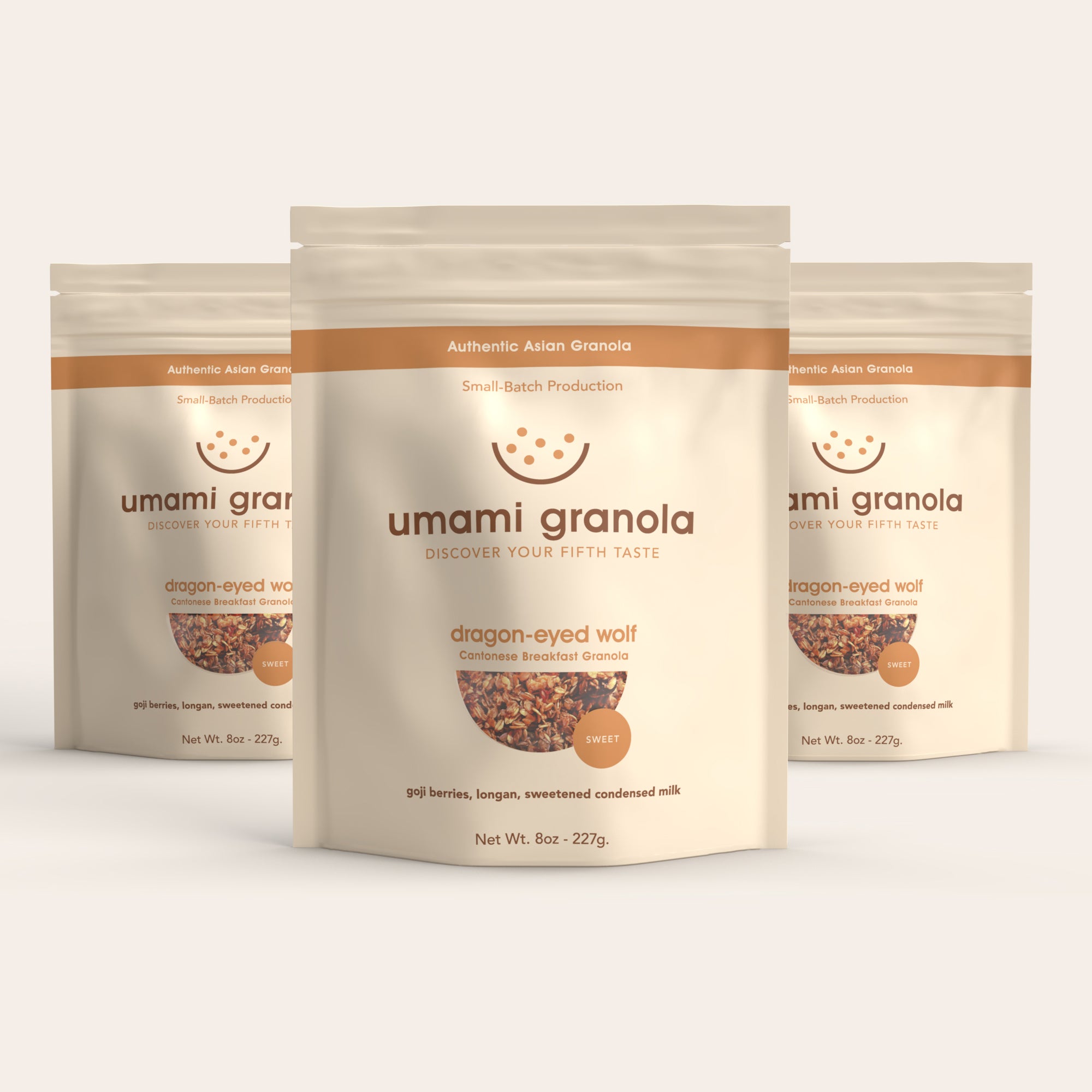 Three packages of umami granola on a white background