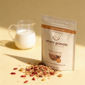 Umami Granola package with granola and a glass of condensed milk on a yellow background