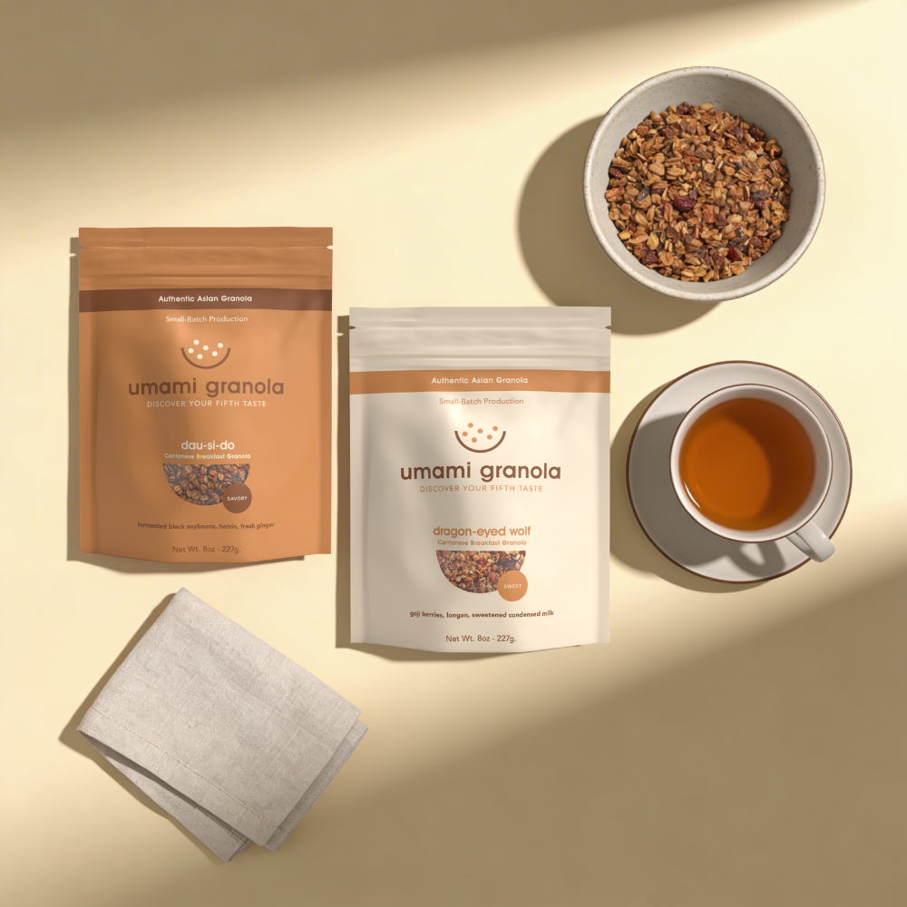 Umami Granola packages with a bowl of granola, a cup of tea, and a napkin on a beige background.