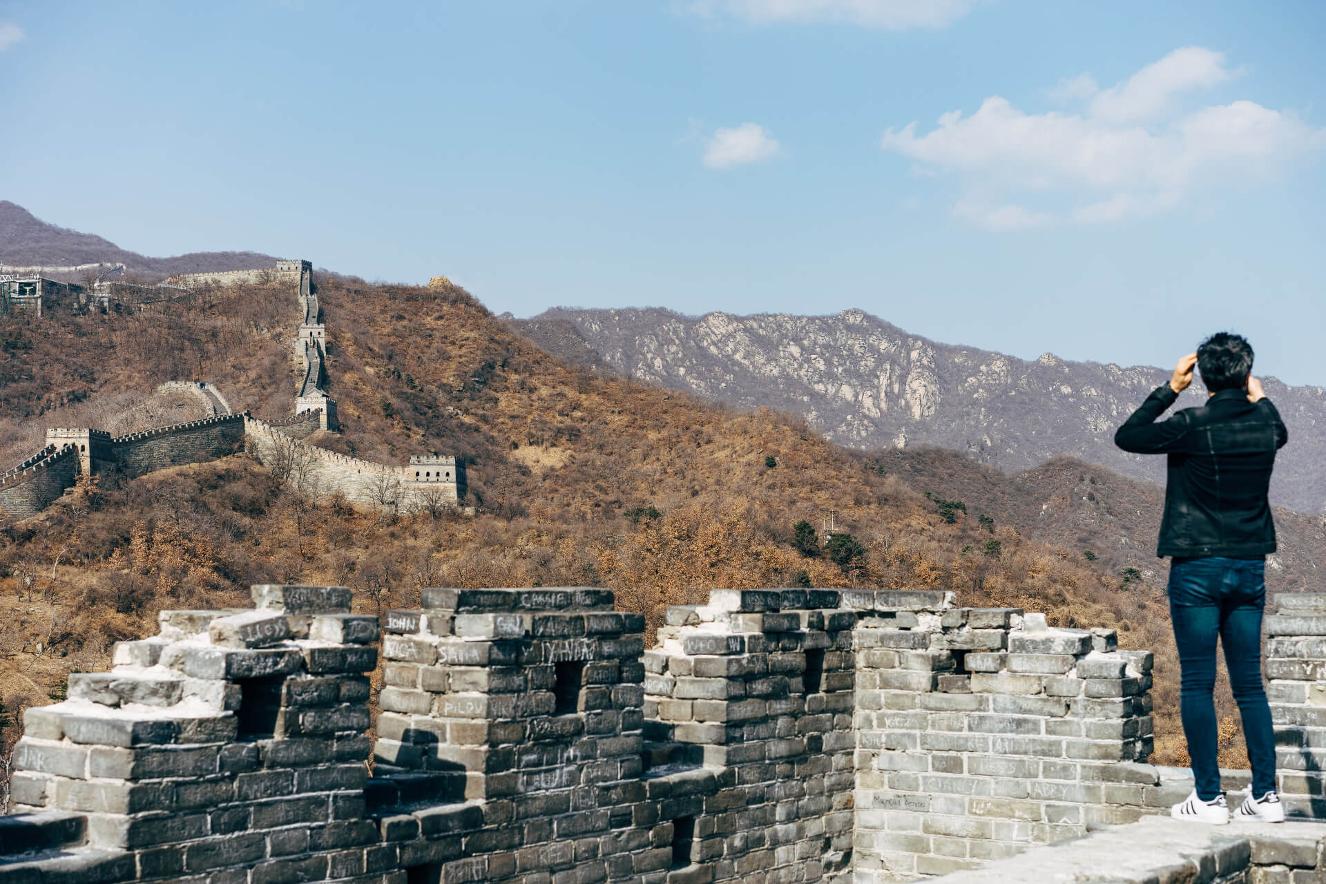 Traditional Chinese hillside settlement with multi-level architecture and historic buildings